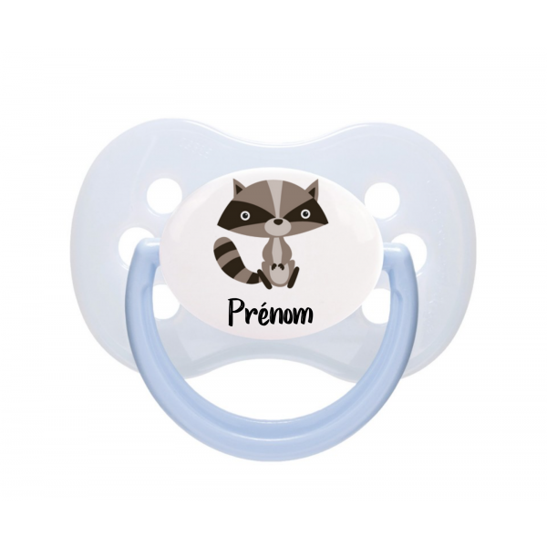 Tétine bébé avec un raton laveur
